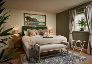 A bed or beds in a room at The Trout at Tadpole Bridge