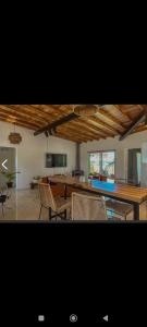 a kitchen and dining room with a table and chairs at Casa mar chiquita in Mar del Plata