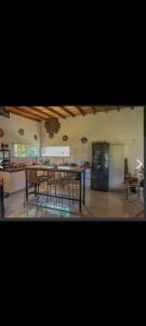 a kitchen and dining room with a table and chairs at Casa mar chiquita in Mar del Plata