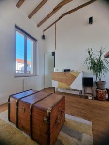 Χώρος καθιστικού στο Un appartement charmant à deux pas de Paris !