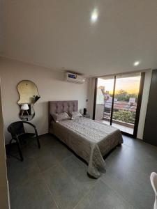 Ένα ή περισσότερα κρεβάτια σε δωμάτιο στο DPTO 205 Edif Loftier