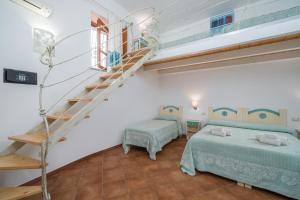 A bed or beds in a room at Bosa Queen House