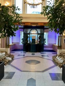 a lobby of a building with a fountain in the middle at Royal Bath Hotel Bournemouth in Bournemouth