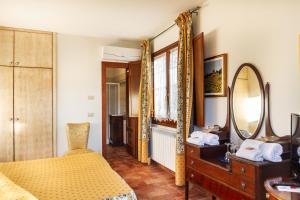 Postel nebo postele na pokoji v ubytování Agriturismo Bio Fattoria Casetta + 37 fotografií