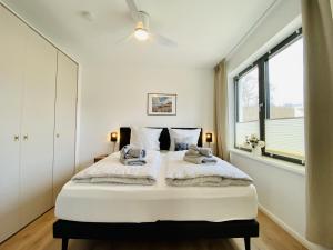 Ένα ή περισσότερα κρεβάτια σε δωμάτιο στο Ferienwohnung Meer & Mehr Parkvillen Carlota und Candela Baabe