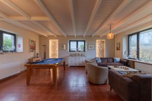 a living room with a ping pong table in it at TY KERZOU - Maison de charme proche mer in Landunvez