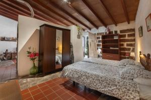 a bedroom with a bed in a room at Casa Rural La Cuadra in Hermigua