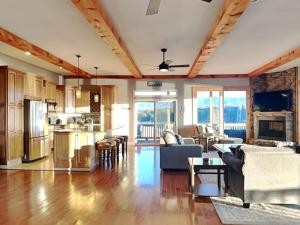 a kitchen and living room with a couch and a table at Wonderland Cove in Dandridge
