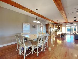 a dining room and living room with a table and chairs at Wonderland Cove in Dandridge
