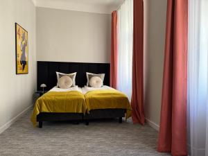 Postel nebo postele na pokoji v ubytování Milla Apartments