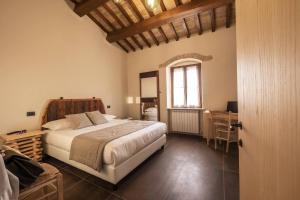 Borgo Degli Angeli Resort e Spa客房内的一张或多张床位