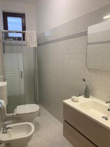 a bathroom with a toilet and a sink at Zar in Omegna