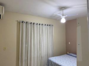 Ένα ή περισσότερα κρεβάτια σε δωμάτιο στο CASA com 3 QUARTOS 1000M DA PRAIA
