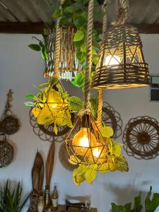 a group of lights hanging from a ceiling at Pousada Moranga in Carolina