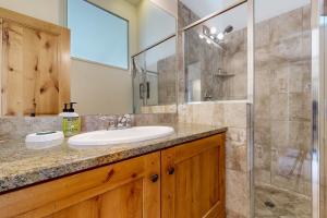 a bathroom with a sink and a shower at Newpark Townhomes 28 in Park City +20 photos