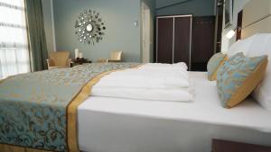 Ένα ή περισσότερα κρεβάτια σε δωμάτιο στο Hotel Class