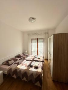 Postel nebo postele na pokoji v ubytování Apartment Gabi