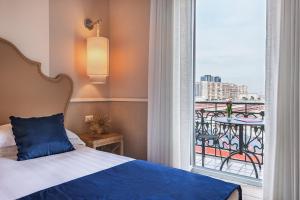 Letto o letti in una camera di Starhotels Terminus