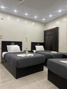 Postel nebo postele na pokoji v ubytování Magic Pyramids Hotel