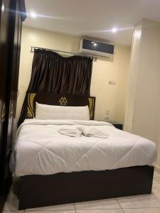 Rúm í herbergi á Magic Pyramids Hotel
