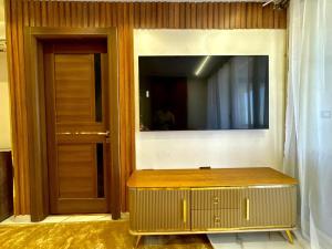 A television and/or entertainment centre at Shiny Pyramids "New Pyramids Gate"