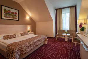 Rúm í herbergi á Hotel Zagreb - Health & Beauty