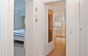 a hallway with a bedroom and a bed in a room at Ferienwohnung Waren Müritz in Waren