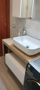 a white sink on a counter in a bathroom at La Casetta di Alex in Ventimiglia
