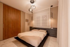 Postel nebo postele na pokoji v ubytování Apartament Exclusive,vicino metro Bengasi Torino