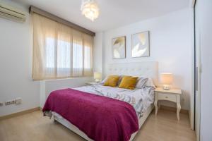 Posteľ alebo postele v izbe v ubytovaní Apartamento Perla