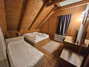 Posteľ alebo postele v izbe v ubytovaní Hotel Tarvisio Four Seasons