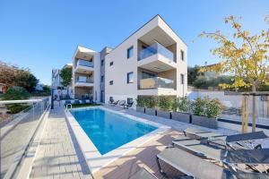 an image of a house with a swimming pool at Villa Urban in Ražanj