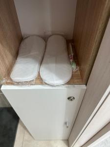 a small white drawer in a small room at Promenade Burabay in Borovoye +3 photos