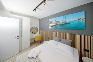 a bedroom with a bed and a desk and a tv at Villa Urban in Ražanj +90 photos