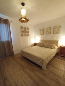 Postel nebo postele na pokoji v ubytování Maisonnette 55m2 Lozari
