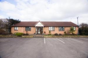 a building with a parking lot in front of it at The Olive in Barnby Dun
