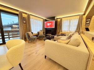 Μια τηλεόραση ή/και κέντρο ψυχαγωγίας στο Apartment Athénée 15 by HBV