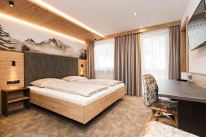 Postel nebo postele na pokoji v ubytování Hotel Garni Pfeifer