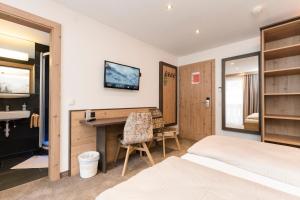 Postel nebo postele na pokoji v ubytování Hotel Garni Pfeifer