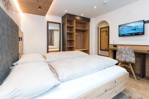 TV a/nebo společenská místnost v ubytování Hotel Garni Pfeifer