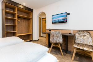 TV a/nebo společenská místnost v ubytování Hotel Garni Pfeifer