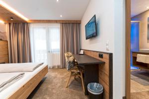 TV a/nebo společenská místnost v ubytování Hotel Garni Pfeifer