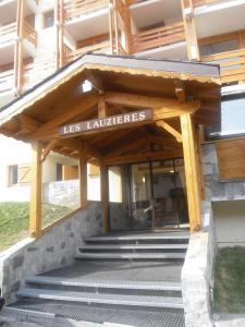 a building with a us laxgars sign on it at Lauzieres 209 Sud in Val Thorens