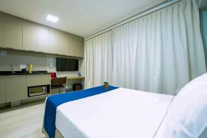 Apartamentos Studio Allure Moema - Com café da manhã opcional, Recepção e Valet 24 horas客房内的一张或多张床位
