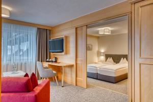 Posteľ alebo postele v izbe v ubytovaní Parkhotel Seefeld