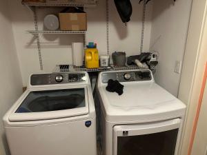 a small kitchen with a stove and a sink at Sugar Hill Inn in Sugar Hill