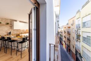 a view of a kitchen and dining room from a balcony at Jardinillos Bed & Parking in Jaén +40 photos