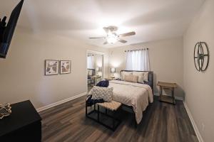 a bedroom with a bed and a ceiling fan at Indian Lakes in Stone Mountain +41 photos