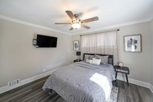 a bedroom with a bed and a ceiling fan at Indian Lakes in Stone Mountain +41 photos