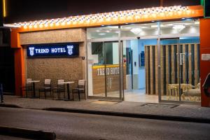 a store front with tables and chairs in front of it at Trend Hotel in Nazilli